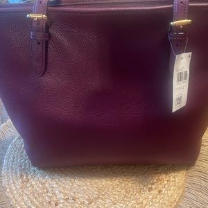 Couch shoulder bag. Deep purple color with gold hardware. Brand new.